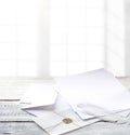 Envelope and paper on white wooden table