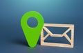 Envelope symbol and geolocation sign in green. Sending or receiving information, messages, or notifications with a geographic