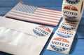 Envelope with voting ballot papers sent by mail for absentee vote in presidential election and I Voted today stickers Royalty Free Stock Photo