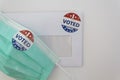 Envelope with voting ballot papers sent by mail and prrotective face mask. Concept of Voting by mail in the USA during coronavirus Royalty Free Stock Photo