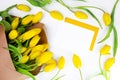 Envelope and yellow tulips on white background, mock up, flat lay with copy space. International women`s day greeting