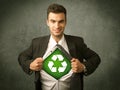 Enviromentalist business man tearing off shirt with recycle sign Royalty Free Stock Photo