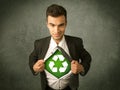 Enviromentalist business man tearing off shirt with recycle sign Royalty Free Stock Photo