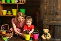 Environment concept. Little child help mother planting flower to new pot, environment. Environment and nature. Make the Royalty Free Stock Photo