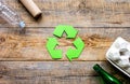 Environment concept with recycling symbol on rustic background top view mockup Royalty Free Stock Photo