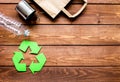 Environment concept with recycling symbol on wooden background top view mock up Royalty Free Stock Photo