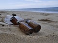 Glass bottles and plastic bottles discarded by the beautiful seaside are indigestible waste.