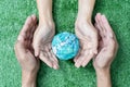 Environment Earth Day In the hands holding green earth on Bokeh green Background, Saving environment, and environmentally Royalty Free Stock Photo