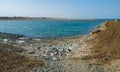 Environment of the Red Sea, Mountains of garbage on the beach away from the resort towns of Marsa Alam, Egypt Royalty Free Stock Photo