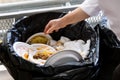 Environment unfriendly styrofoam plates and cups in plastic garb