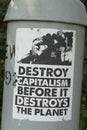 Environmental activist poster that says destroy capitalism before it destroys the planet Royalty Free Stock Photo