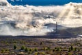 Environmental disaster. Copper plant in valley against the background of the mountains, toxic smoke from the pipes, dramatic rain Royalty Free Stock Photo
