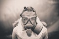Environmental disaster.Woman breathing trough gas mask,health in danger.Concept of pollution Royalty Free Stock Photo