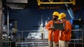 Environmental engineers on offshore platform conduct inspections Royalty Free Stock Photo