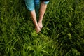 Environmental Farmer hands reaching in greens