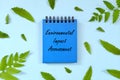 Environmental Impact Assessment or EIA concept. Word written on blue notepad. Beautiful minimalist flat lay