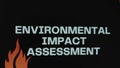 Environmental Impact Assessment inscription on black background. Graphic presentation with fire flames and transparent