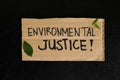 Environmental justice, ecological and climate justice concept. Carton placard with handwritten message Royalty Free Stock Photo