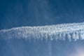 Blue sky with chemtrails or contrails Royalty Free Stock Photo