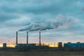 Environmental pollution, environmental problem, smoke from the chimney of an industrial plant or thermal power plant against a Royalty Free Stock Photo