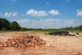 Environmental pollution. Landfill of broken bricks and used tires Royalty Free Stock Photo