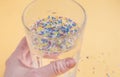 Environmental pollution and water microplastic. Micro plastic with spoon Royalty Free Stock Photo