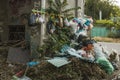 Environmental problem of the big city. Garbage collection for disposal by hanging on hooks mounted on the wall of the building. Royalty Free Stock Photo