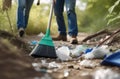 Environmental problems. A man in a protective glove collects plastic garbage in nature, volunteers clean the forest from Royalty Free Stock Photo