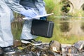 Environmental protection company employee makes measurements of river water purity