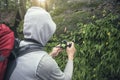 Environmental scientist photographing researching the environment and natural diversity. Royalty Free Stock Photo