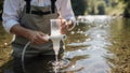 An environmental scientist taking a water sample for research Royalty Free Stock Photo