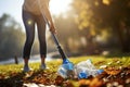 Environmental stewardship, Closeup of person cleaning plastic pollution in a park