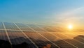 Environmental sustainable energy concept. Solar panels clean energy generating electricity. Photovoltaic cells on the sunset Royalty Free Stock Photo