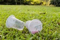 Environmental unfriendly non-biodegradable PVC cup litter in public park Royalty Free Stock Photo