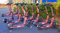 environmentally friendly electric city scooters controlled by an app waiting to be riden