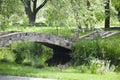Environmentally sustainable design. Landscape architecture and landscaping. Landscape park. Stone bridge on summer landscape. Old Royalty Free Stock Photo