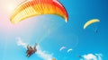 Envision the breathtaking spectacle of people paragliding against a backdrop of endless blue sky, their silhouettes gliding