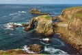 The Enys Dodman Arch at Land`s End, a headland and holiday complex in western Cornwall, England Royalty Free Stock Photo