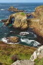 The Enys Dodman Arch at Land`s End, a headland and holiday complex in western Cornwall, England Royalty Free Stock Photo