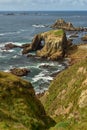 The Enys Dodman Arch at Land`s End, a headland and holiday complex in western Cornwall, England Royalty Free Stock Photo