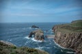 Enys Dodnan arch on a summer day Lands End Cornwall England Royalty Free Stock Photo