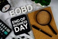 EOBD - End Of Business Day acronym with calculator, alarm clock and magnifying glass, Business concept background Royalty Free Stock Photo
