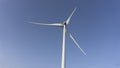 Eolic turbine isolated on a blue sky backgroudn, wind energy Royalty Free Stock Photo