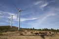 Eolic wind Turbines on a modern windmill farm for alternative energy generation Royalty Free Stock Photo