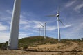 Eolic wind Turbines on a modern windmill farm for alternative energy generation