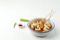 Eomukguk or Odeng Soup, Korean Popular Street Food Made from Fish Cake Eomuk and Spicy Gochujang Paste. On White Table