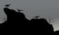 Eoraptor in cliff silhouette at night