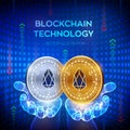 EOS. Blockchain. 3D Physical bit coin. Block chain concept. Digital currency. Golden and silver coins with EOS symbol in hands. Royalty Free Stock Photo
