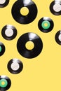 EP and two LP vinyl records inspired arrangement of funky pattern against illuminating yellow background Royalty Free Stock Photo