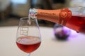 Bartender pouring Taittinger rose champagne into glass Royalty Free Stock Photo